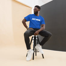 Load image into Gallery viewer, The perfect gift for drummers — the Just Drum Tee in blue from Drum Club Global. Premium unisex fit with bold JUST DRUM print. Rep the culture. Ships from Nashville, TN.