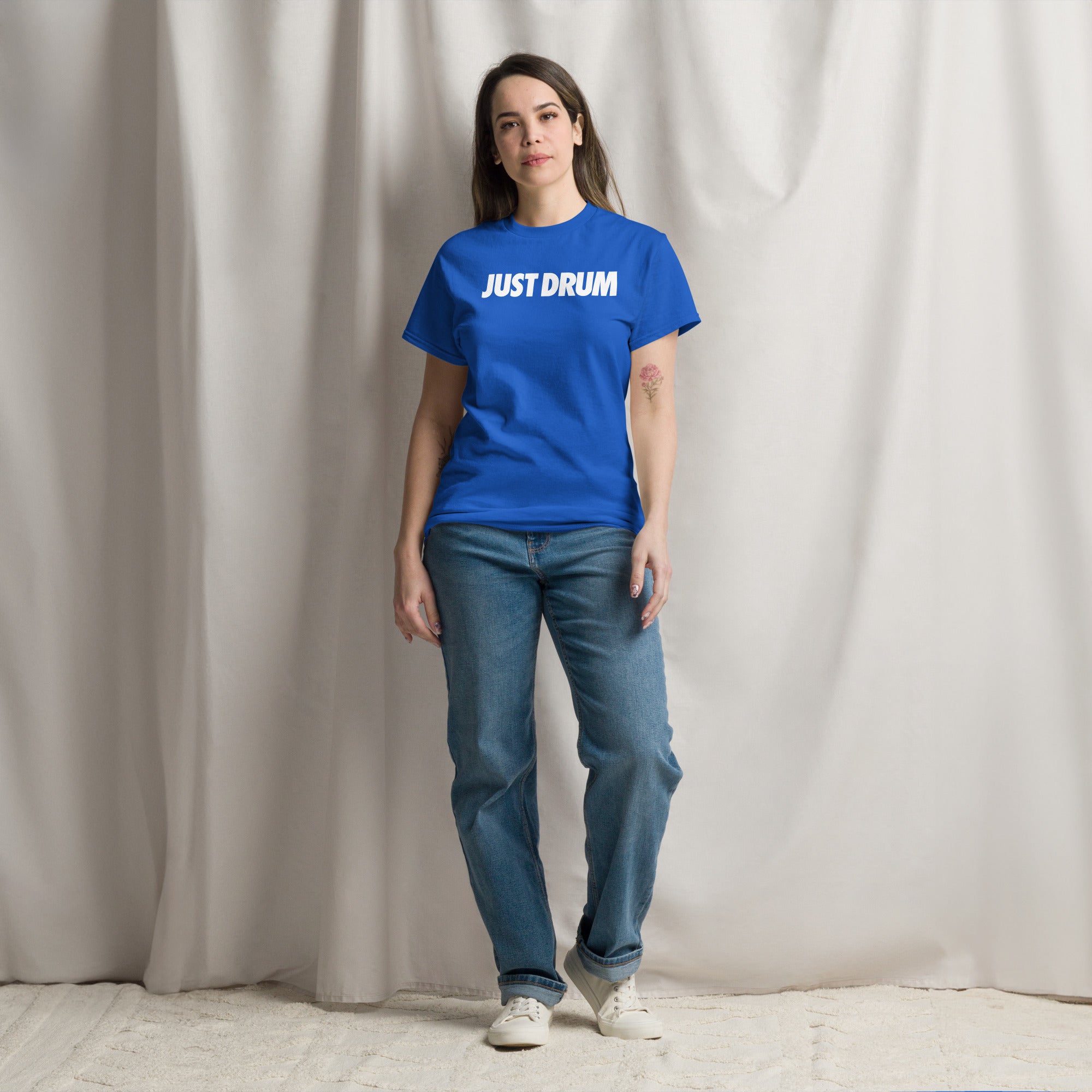 Rep the culture in blue. The Drum Club Global Just Drum Tee features a bold JUST DRUM chest print on a premium blue unisex tee. The perfect drummer gift. Ships from Nashville, TN.